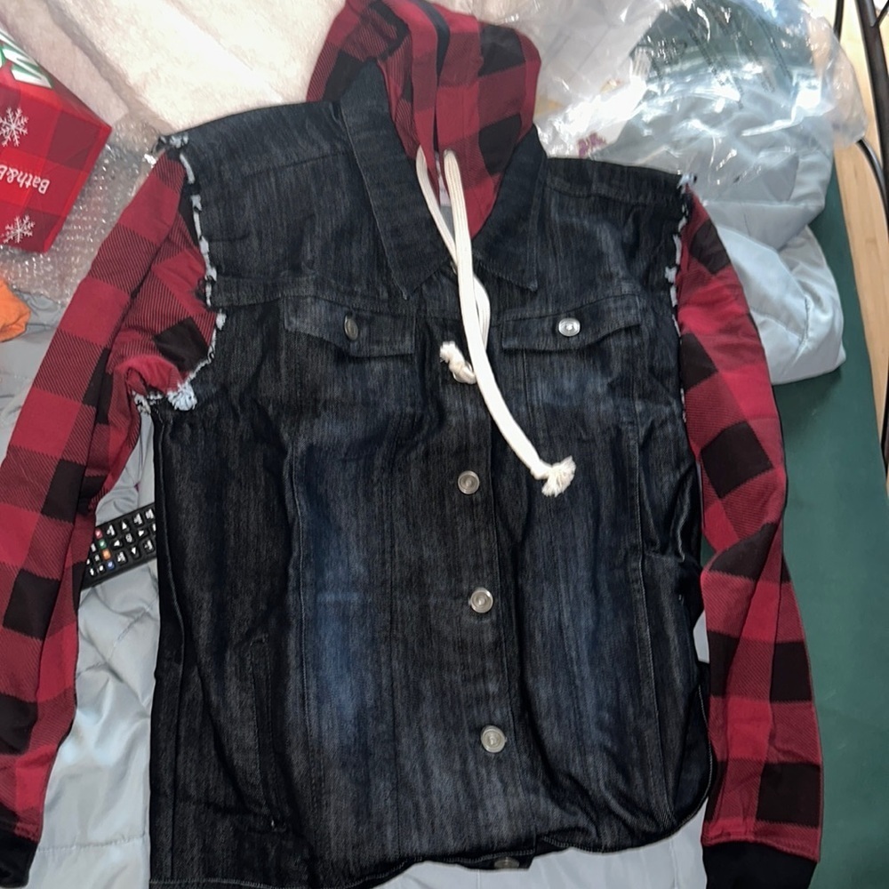 Black denim jacket with plaid sleeves and hoodie size small